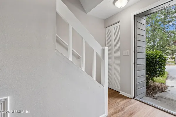 a view of entryway with wooden floor
