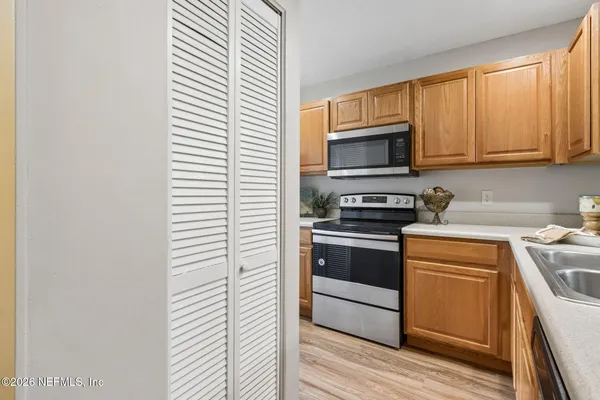 a kitchen with a stove and a microwave
