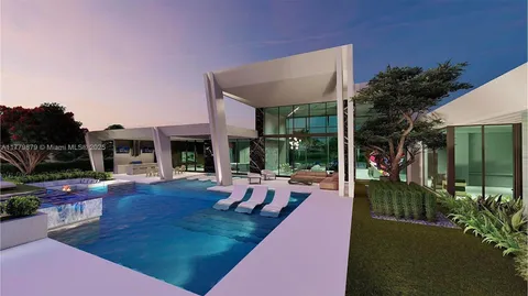 a view of a house with backyard porch and sitting area