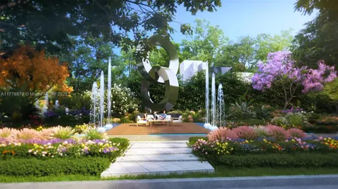 a view of a fountain with flower plants