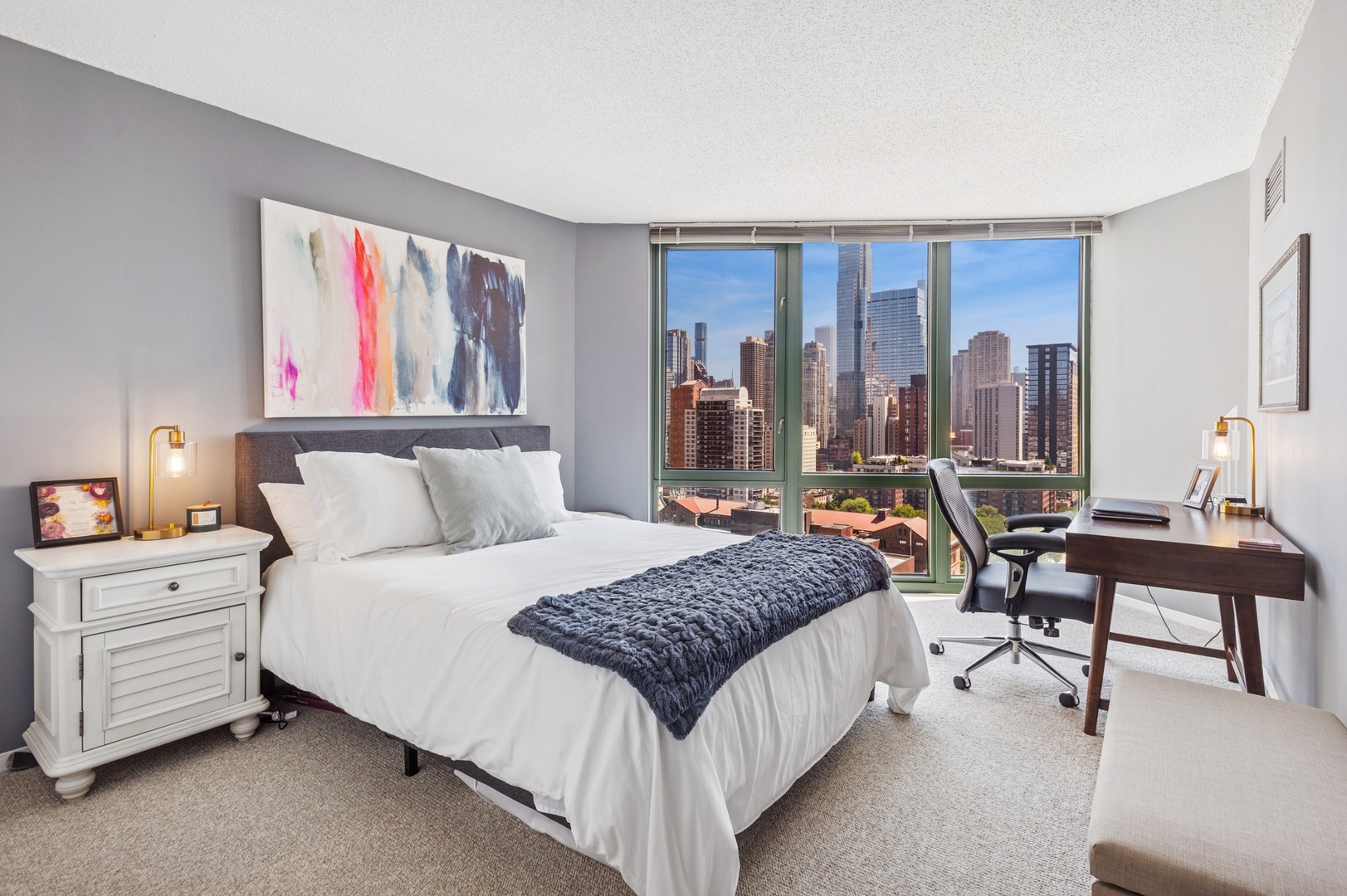 111 West Maple Street, Unit 1704 Chicago, IL 60610 - Photo 15 of 24 a bedroom with a bed and with furniture