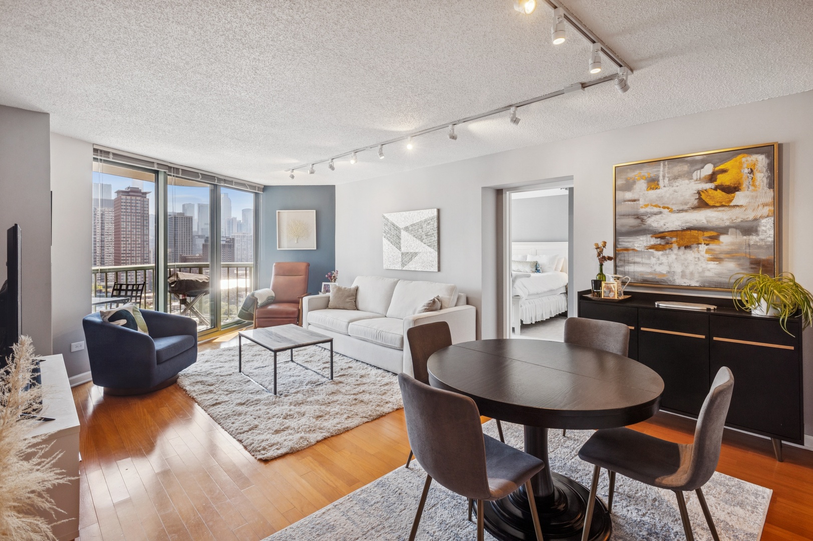 111 West Maple Street, Unit 1704 Chicago, IL 60610 - Photo 3 of 24 a living room with furniture and a table