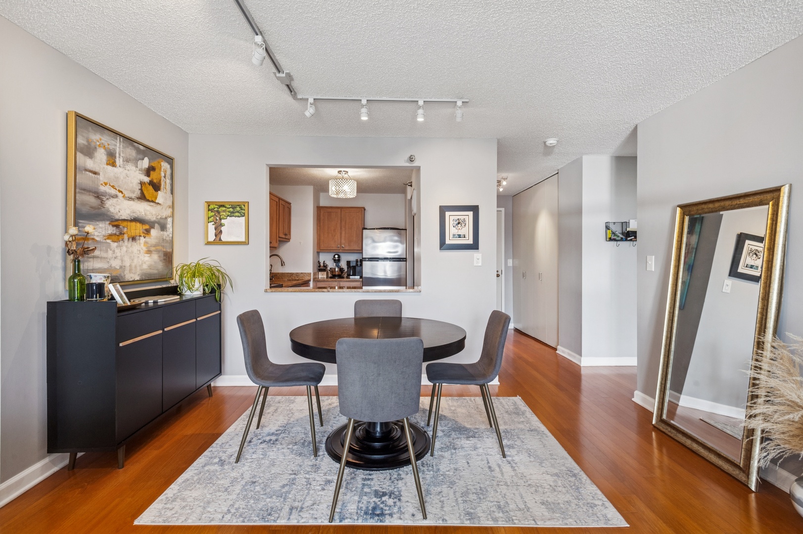 111 West Maple Street, Unit 1704 Chicago, IL 60610 - Photo 6 of 24 a living room with furniture a large window and wood floor