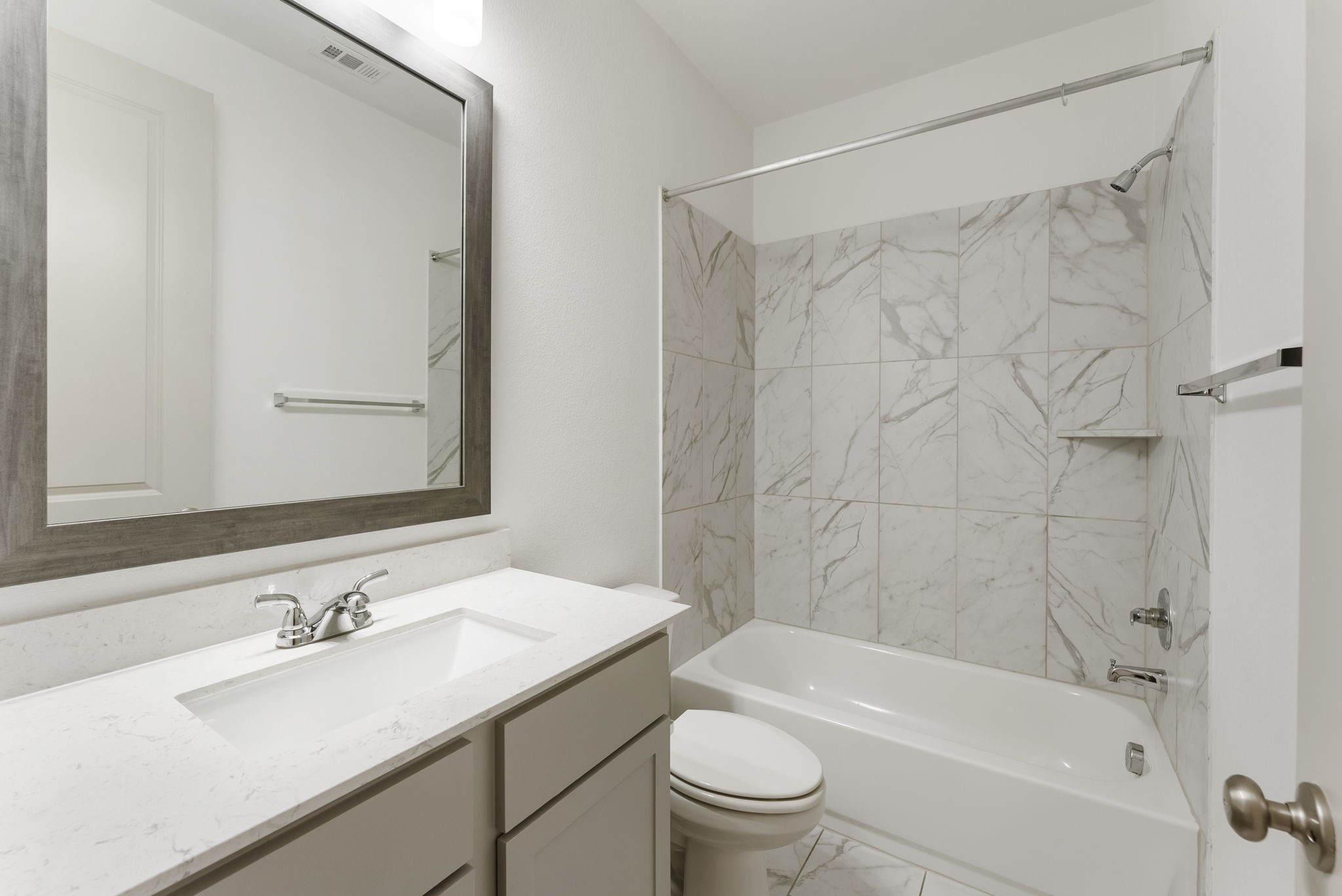 17192 Wild Robin Lane Conroe, TX 77302 - Photo 12 of 15 a bathroom with a granite countertop sink a toilet and shower