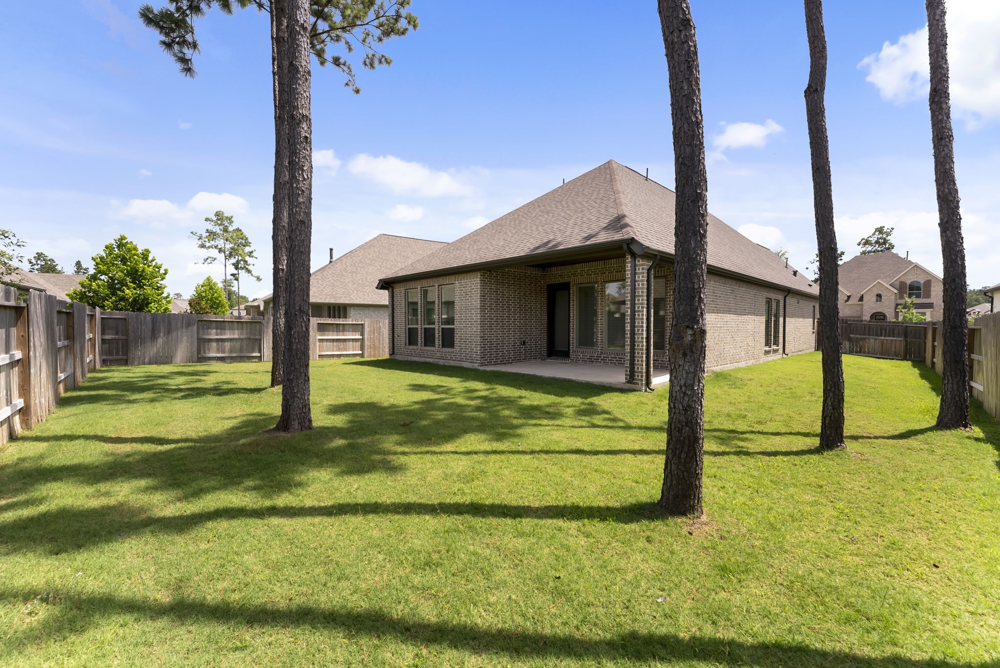 17192 Wild Robin Lane Conroe, TX 77302 - Photo 15 of 15 a view of a house with a swimming pool