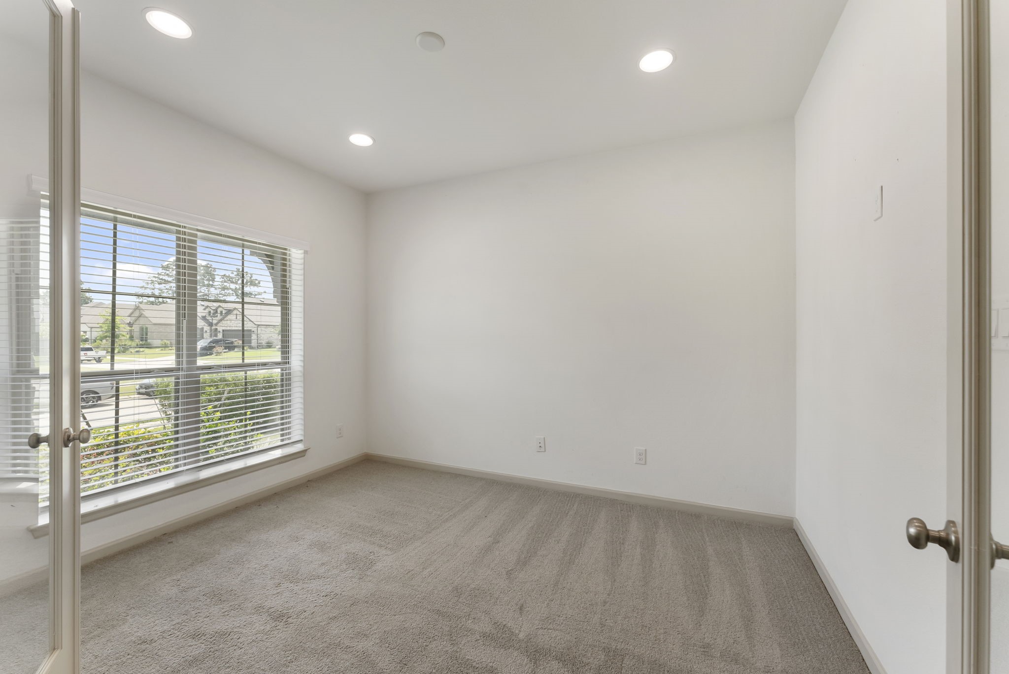 17192 Wild Robin Lane Conroe, TX 77302 - Photo 5 of 15 an empty room with windows