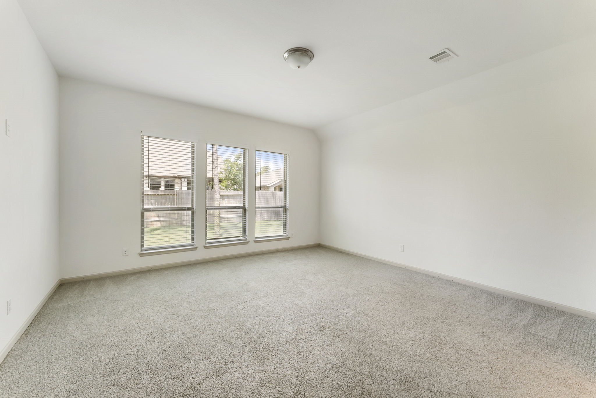 17192 Wild Robin Lane Conroe, TX 77302 - Photo 8 of 15 a view of an empty room with a window