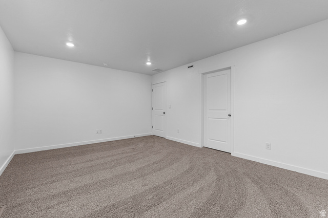 2829 North 710 West, Unit 15 Logan, UT 84321 - Photo 17 of 23 Spacious room featuring neutral carpeting and white painted walls