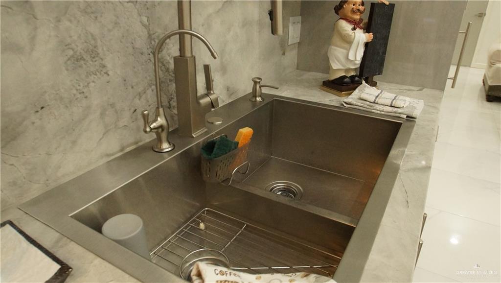 414 Ric Mar Street Edinburg, TX 78541 - Photo 20 of 36 Stainless steel double basin sink with a brushed nickel gooseneck faucet