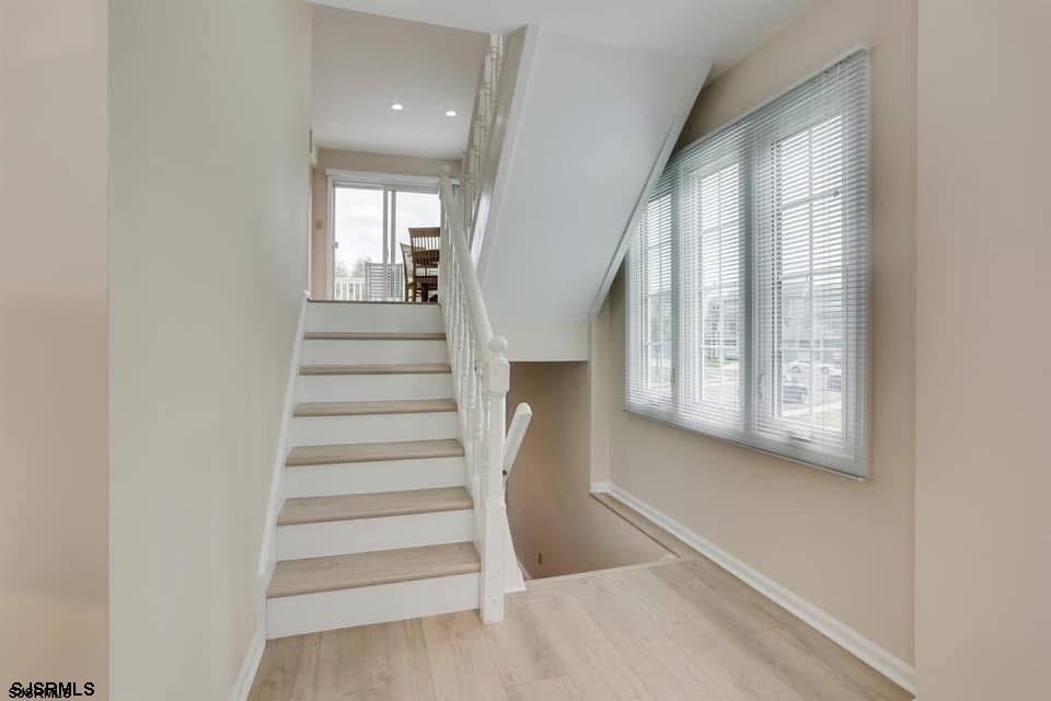 433 Albacore Lane Brigantine, NJ 08203 - Photo 11 of 22 a view of entryway and hall with wooden floor