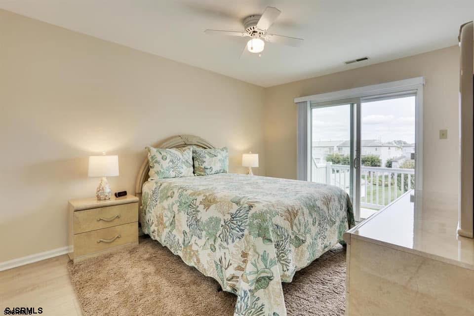 433 Albacore Lane Brigantine, NJ 08203 - Photo 15 of 22 a bedroom with a large bed and a tv