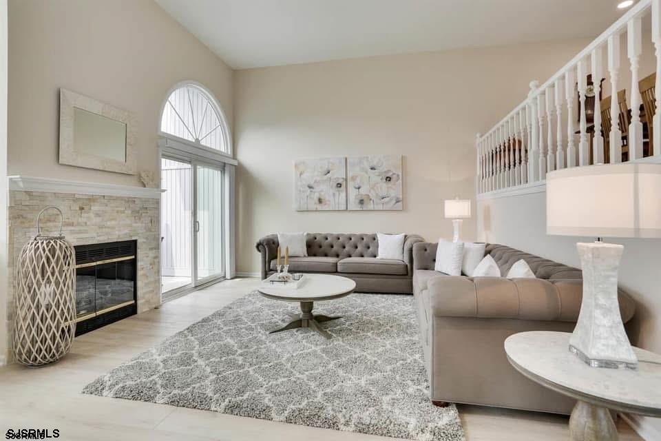 433 Albacore Lane Brigantine, NJ 08203 - Photo 2 of 22 a living room with furniture and a fireplace