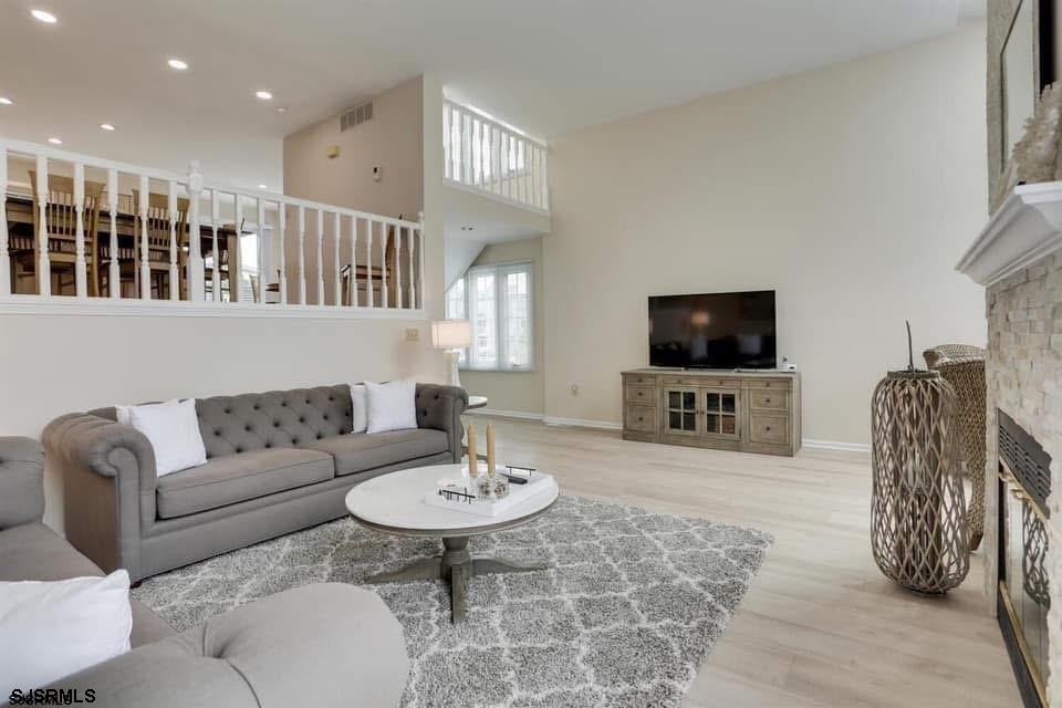 433 Albacore Lane Brigantine, NJ 08203 - Photo 4 of 22 a living room with furniture and a flat screen tv