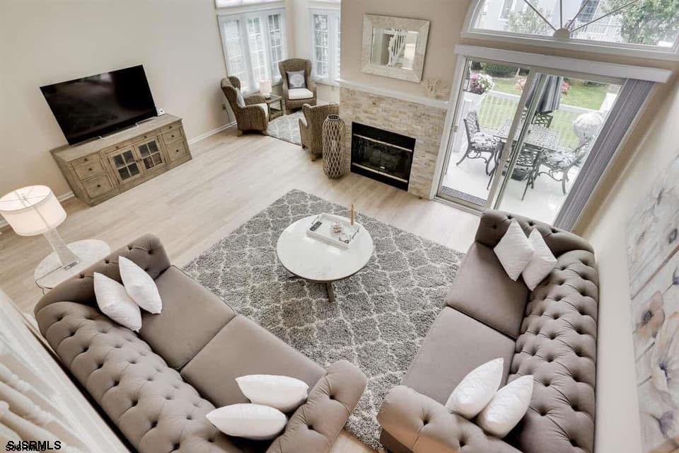 433 Albacore Lane Brigantine, NJ 08203 - Photo 6 of 22 a living room with furniture and a fireplace