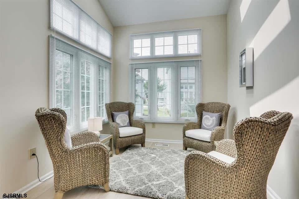 433 Albacore Lane Brigantine, NJ 08203 - Photo 9 of 22 a living room with furniture and a large window