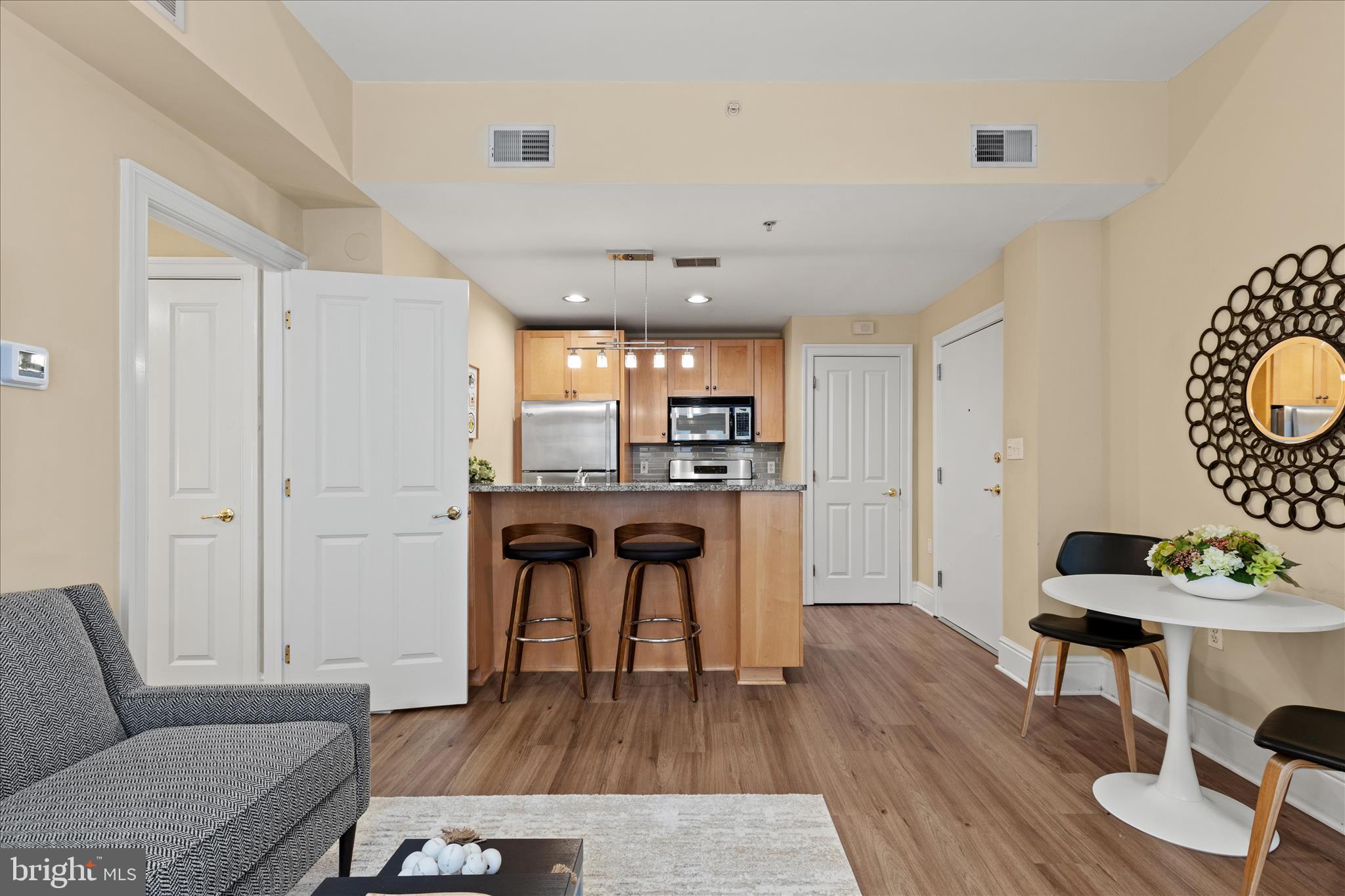 1625 16th Street Northwest, Unit 302 Washington, DC 20009 - Photo 12 of 26 a living room with furniture and a wooden floor