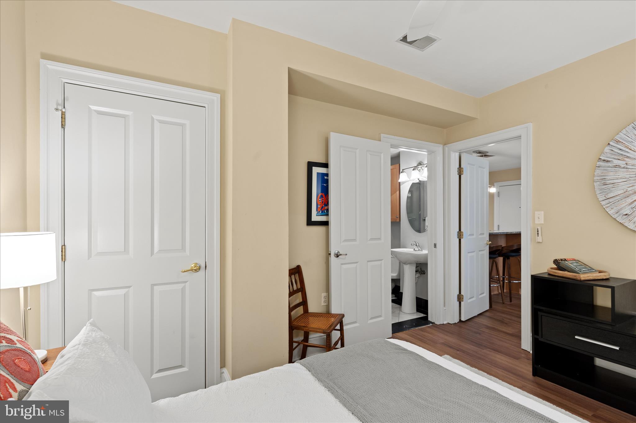 1625 16th Street Northwest, Unit 302 Washington, DC 20009 - Photo 15 of 26 a bedroom with a bed and a mirror