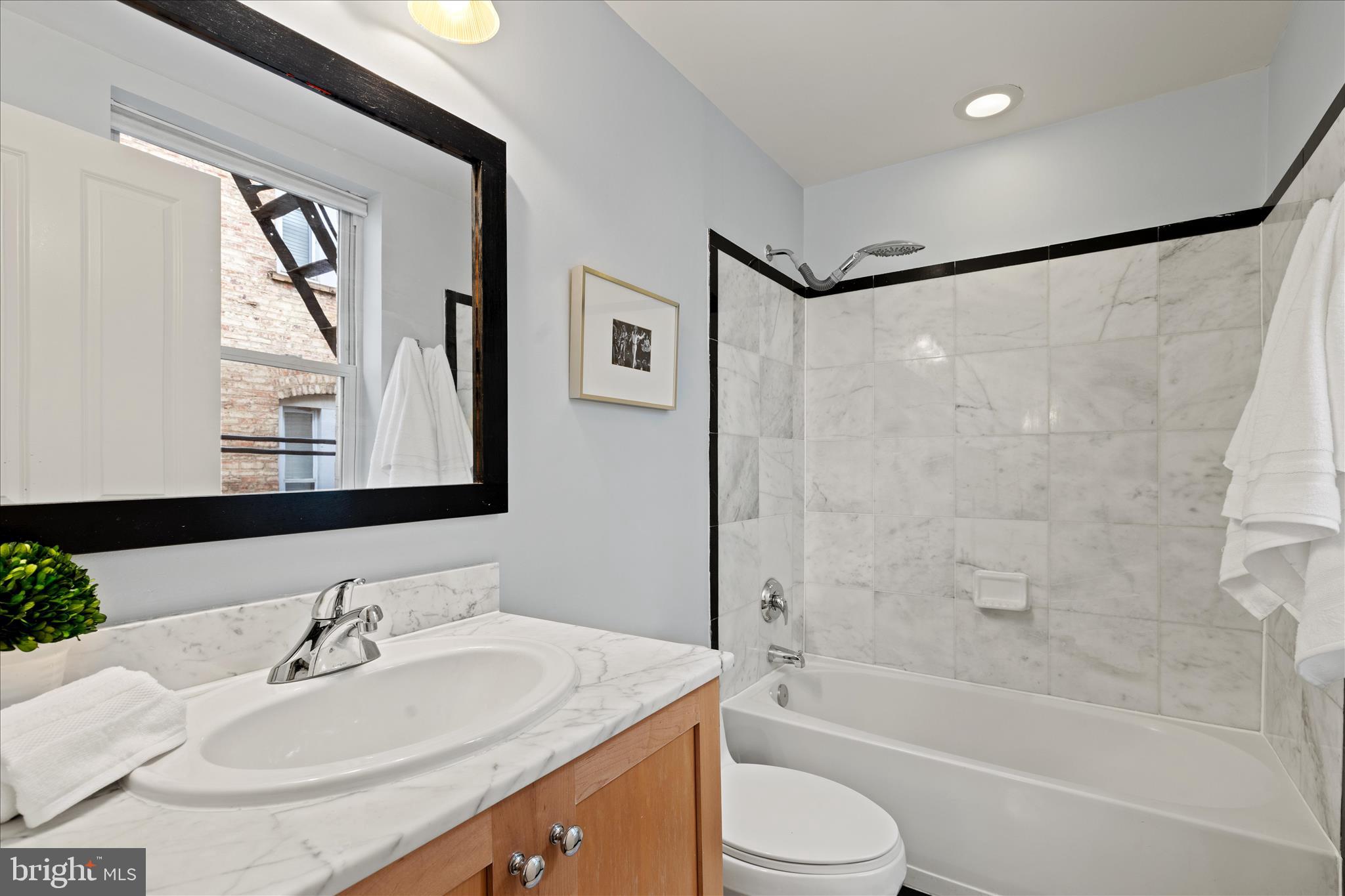 1625 16th Street Northwest, Unit 302 Washington, DC 20009 - Photo 20 of 26 a bathroom with a sink and a mirror