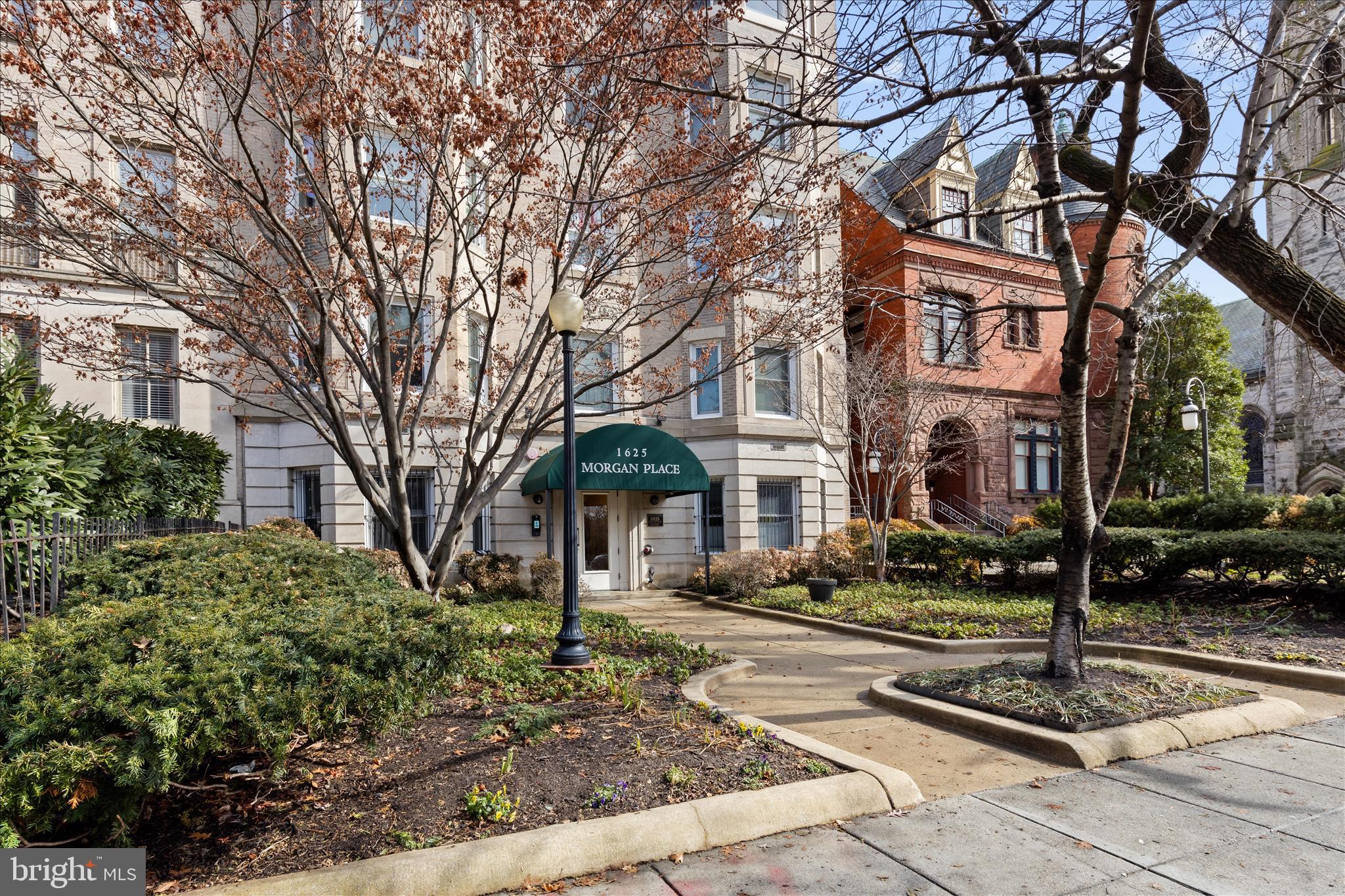 1625 16th Street Northwest, Unit 302 Washington, DC 20009 - Photo 25 of 26 a front view of a building with trees