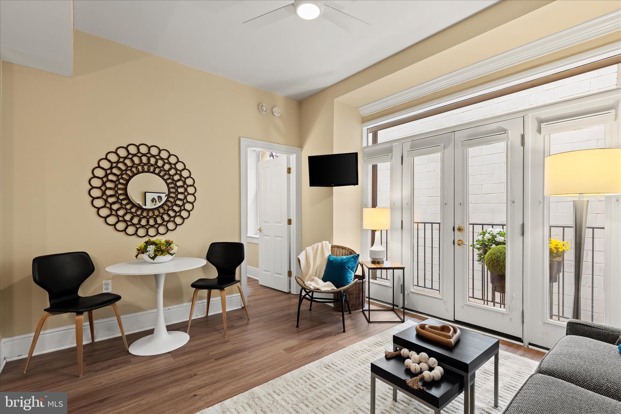 1625 16th Street Northwest, Unit 302 Washington, DC 20009 - Photo 5 of 26 a living room with furniture and a large window