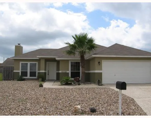 a house view with a backyard space