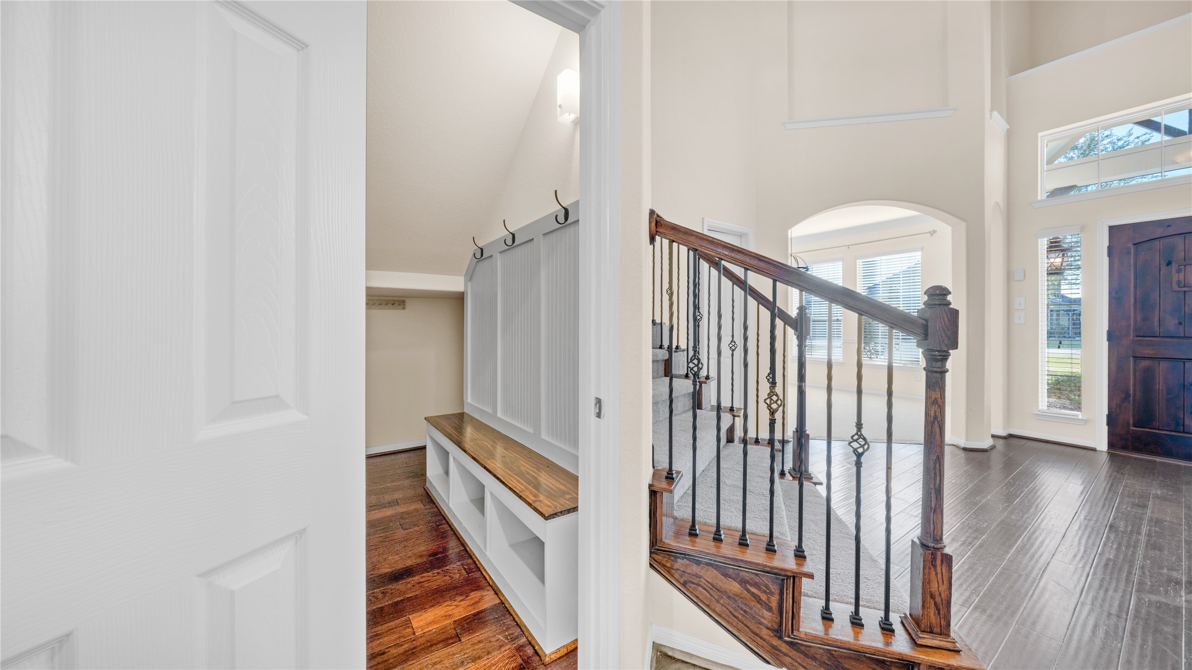 4603 Clearwater Road Baytown, TX 77523 - Photo 4 of 31 a view of a hallway with wooden floor and staircase