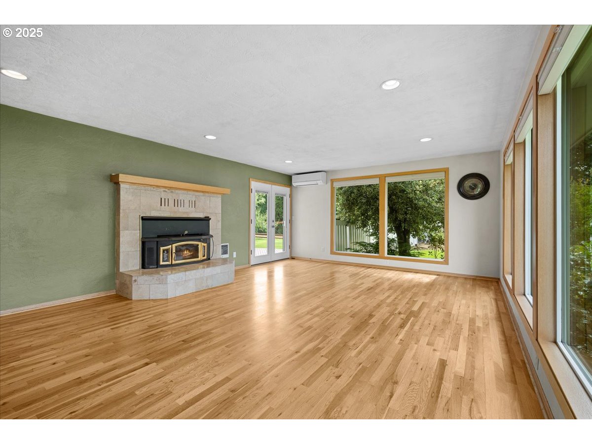 11623 Broadacres Road Northeast Hubbard, OR 97032 - Photo 16 of 48 a view of empty room with window and fireplace
