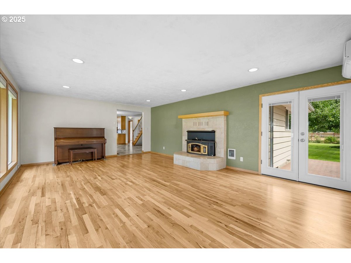 11623 Broadacres Road Northeast Hubbard, OR 97032 - Photo 17 of 48 a bedroom with a bed and a view of kitchen