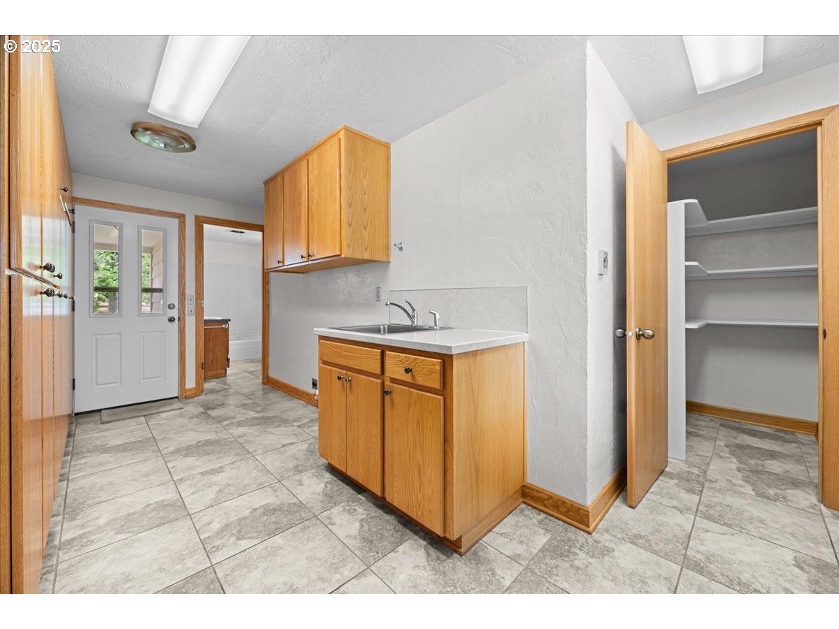 11623 Broadacres Road Northeast Hubbard, OR 97032 - Photo 24 of 48 a kitchen with stainless steel appliances granite countertop a refrigerator and a stove top oven
