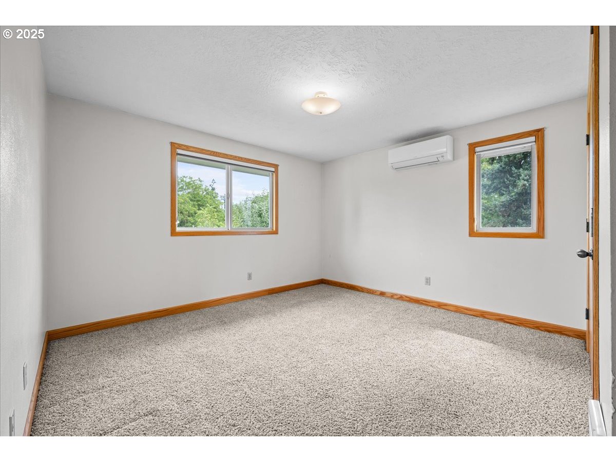 11623 Broadacres Road Northeast Hubbard, OR 97032 - Photo 29 of 48 an empty room with windows