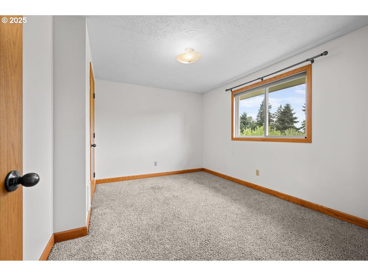 11623 Broadacres Road Northeast Hubbard, OR 97032 - Photo 30 of 48 a view of an empty room with a window