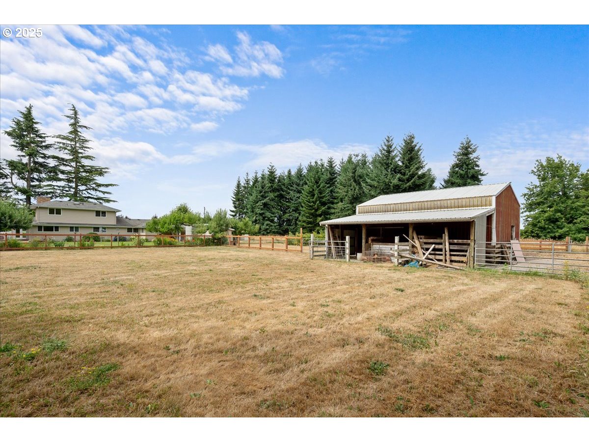 11623 Broadacres Road Northeast Hubbard, OR 97032 - Photo 42 of 48 a view of a house with a yard