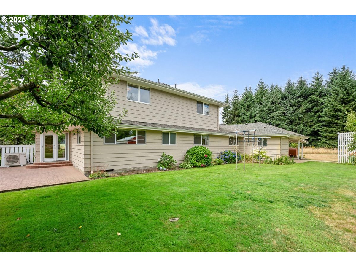 11623 Broadacres Road Northeast Hubbard, OR 97032 - Photo 48 of 48 a front view of a house with a yard and green space