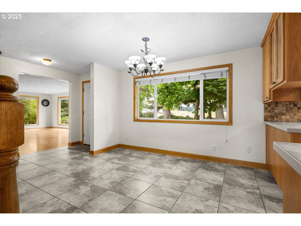 11623 Broadacres Road Northeast Hubbard, OR 97032 - Photo 7 of 48 a view of an empty room with a window