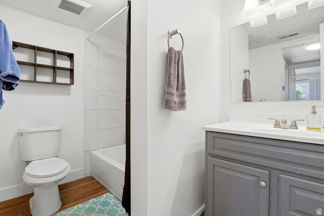 88 West 50 South, Unit P10 Centerville, UT 84014 - Photo 15 of 20 Bathroom with vanity, dark wood-style flooring, and bathtub / shower combination