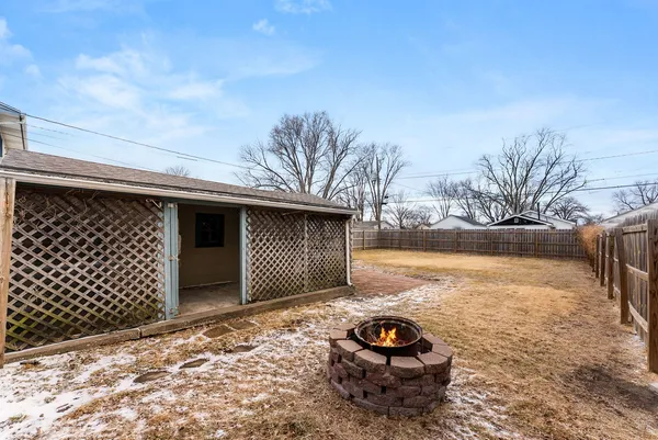 a view of a backyard of the house