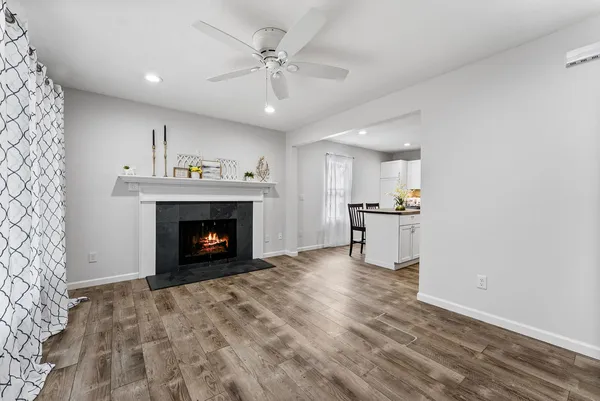 a view of an empty room with a fireplace