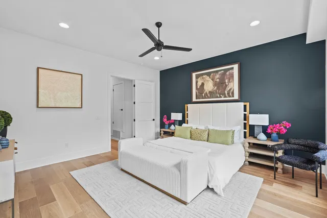 a bedroom with a bed and a desk