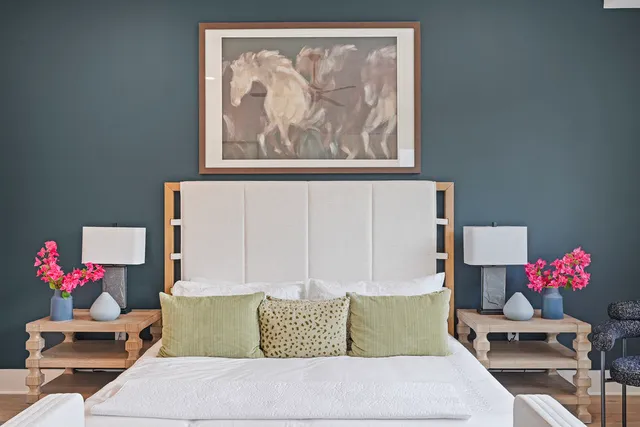 a living room with furniture and flowers