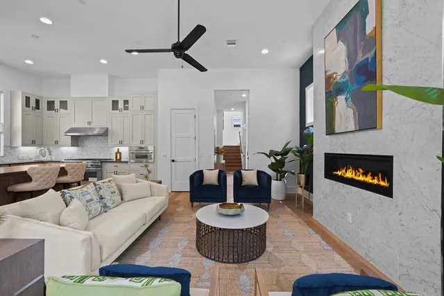 a living room with furniture and a fireplace