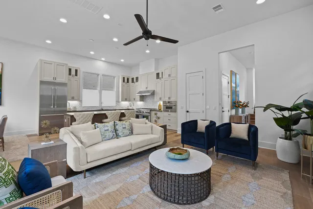 a living room with furniture and a rug