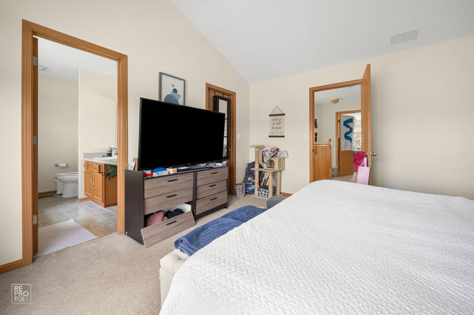 1827 Golden Gate Lane Naperville, IL 60563 - Photo 8 of 13 a bedroom with a bed and a flat screen tv