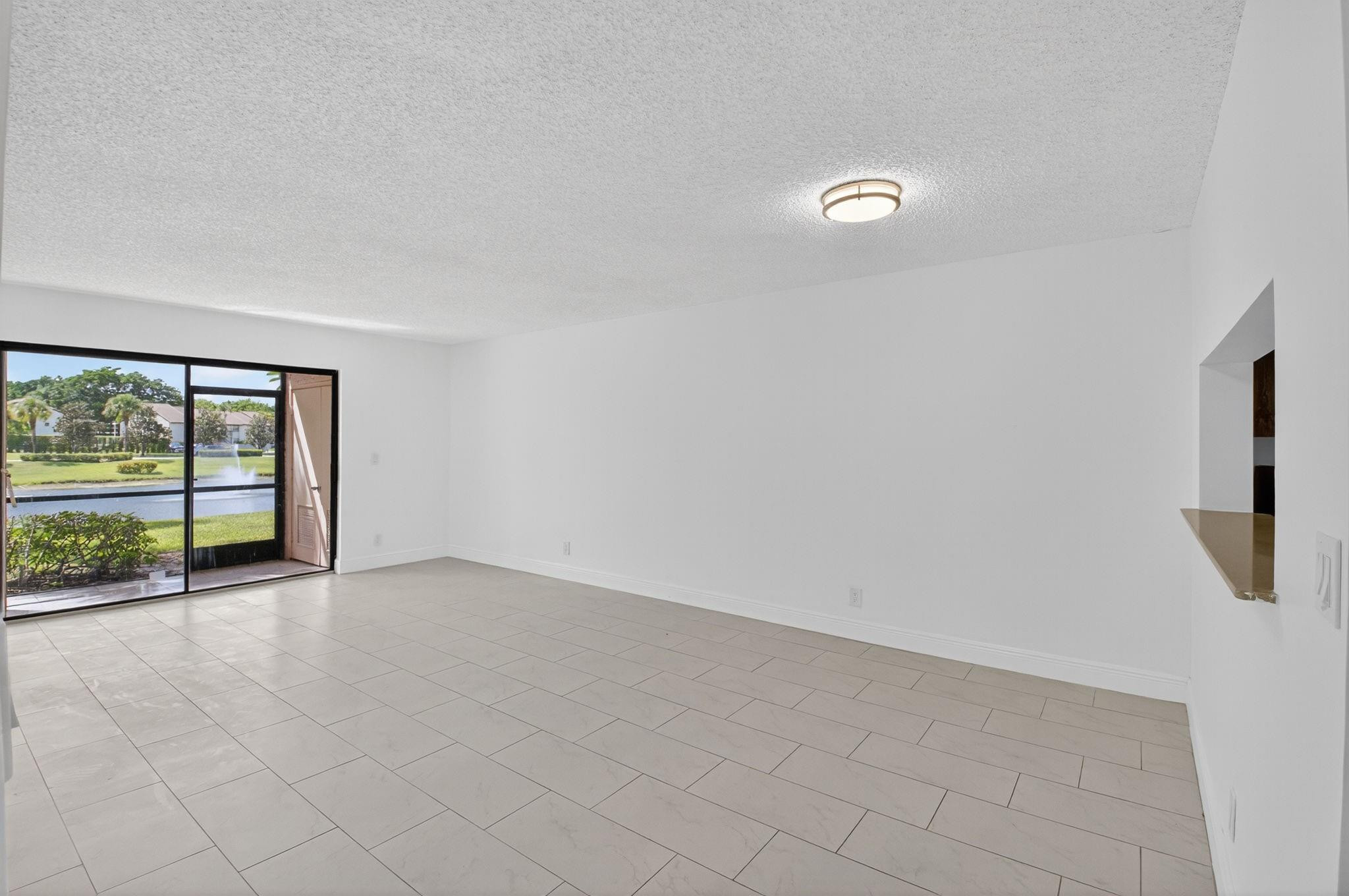 22053 Palms Way, Unit 105 Boca Raton, FL 33433 - Photo 3 of 44 Bright Living Room Area