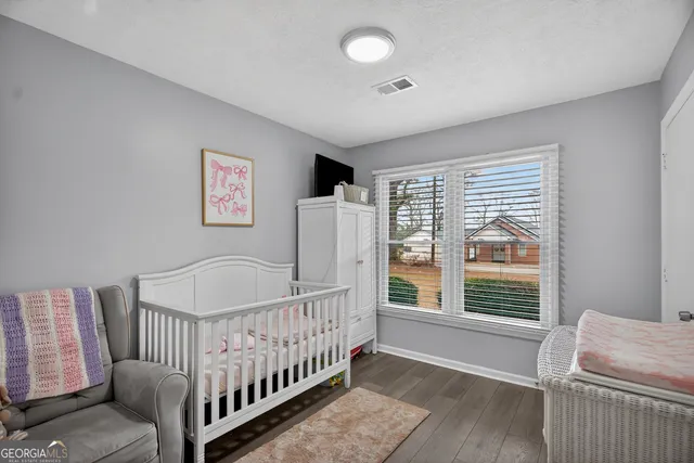 a bedroom with furniture and a window