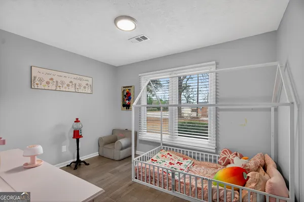 a bedroom with furniture and a window