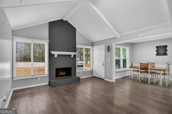 a view of a livingroom with furniture and a fireplace