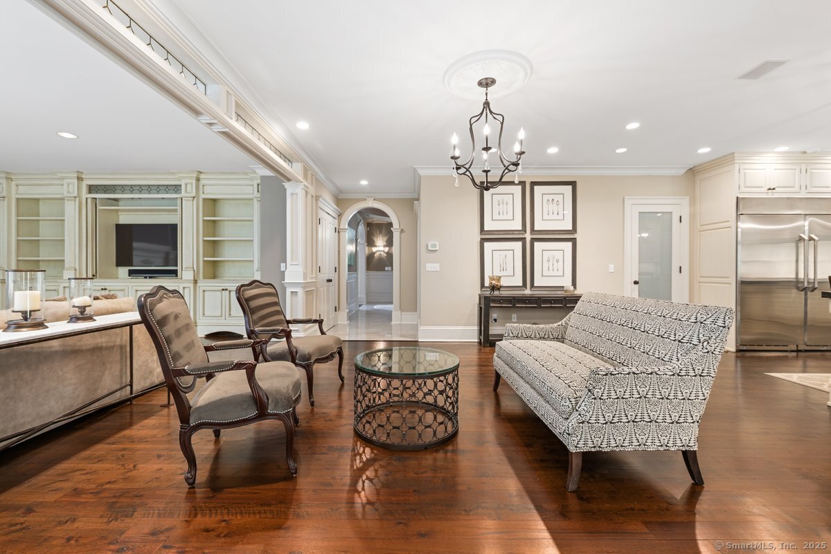 174 Branchville Road Ridgefield, CT 06877 - Photo 12 of 40 a living room with furniture wooden floor and a chandelier