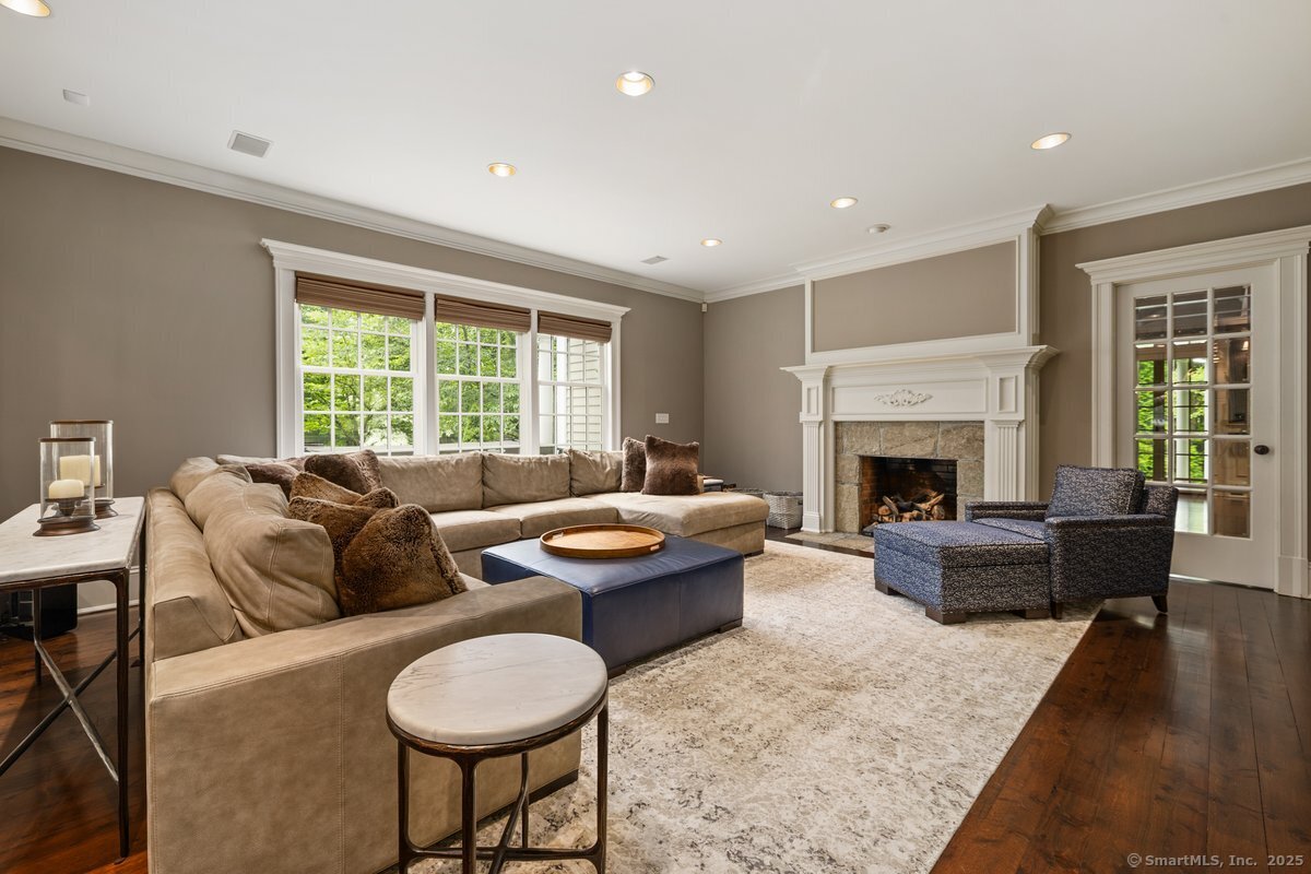 174 Branchville Road Ridgefield, CT 06877 - Photo 14 of 40 a living room with furniture a fireplace and a table