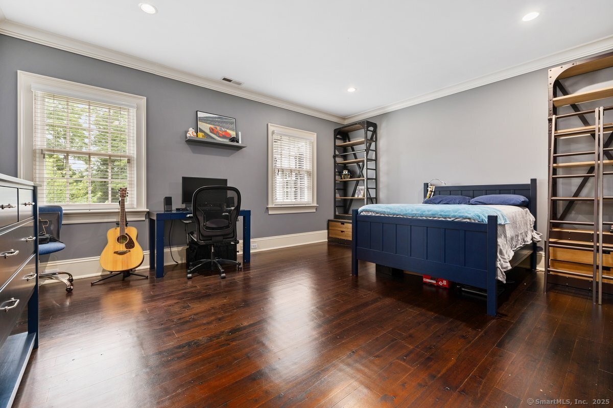 174 Branchville Road Ridgefield, CT 06877 - Photo 22 of 40 a bedroom with furniture and a wooden floor