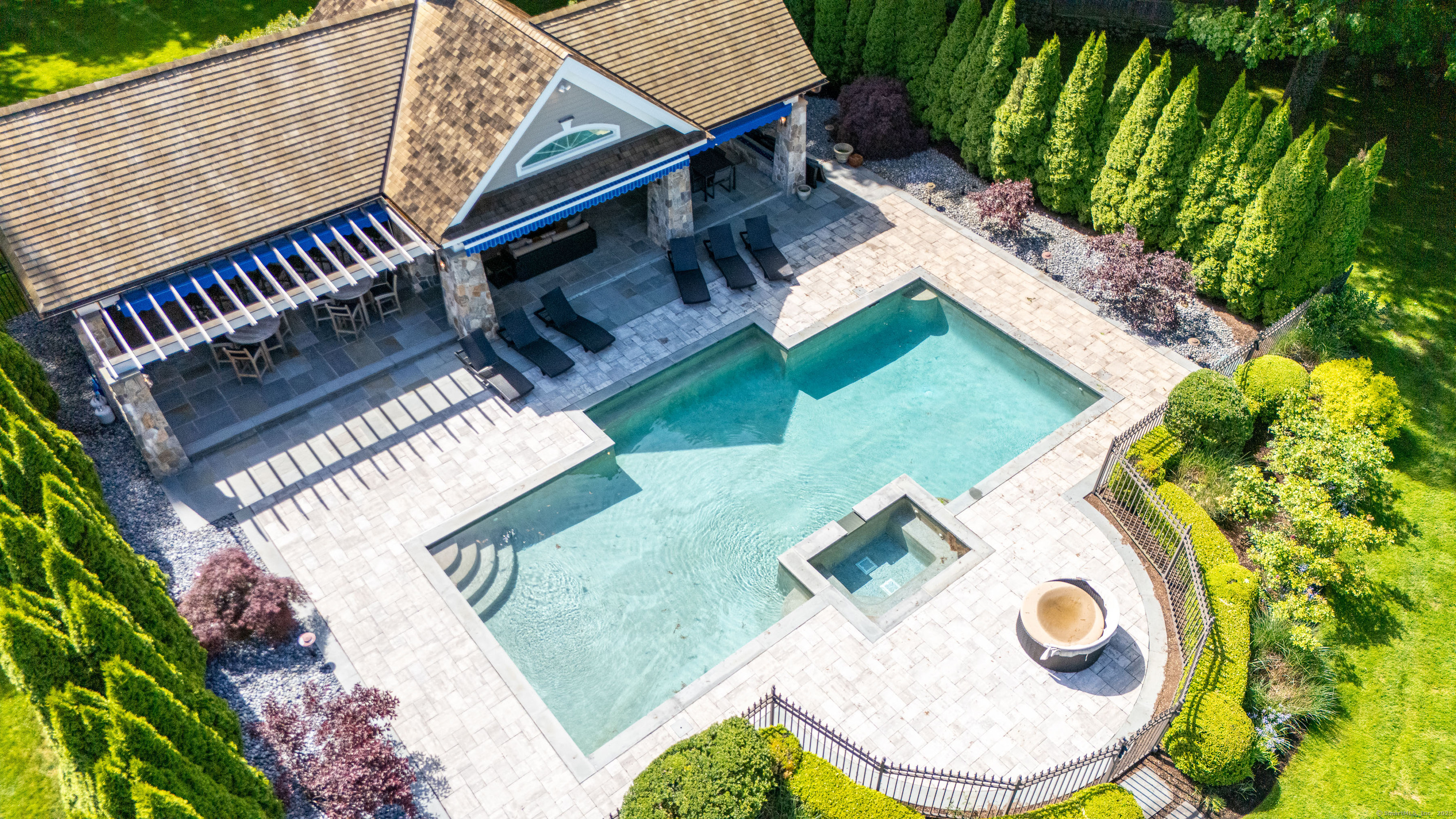 174 Branchville Road Ridgefield, CT 06877 - Photo 32 of 40 an aerial view of a house with a swimming pool and outdoor seating